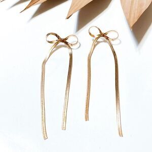 Gold bow drop earrings S290